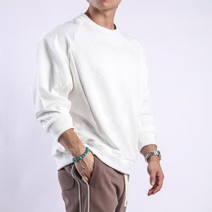 Camiseta de manga larga con cuello redondo y textura de color liso para hombre