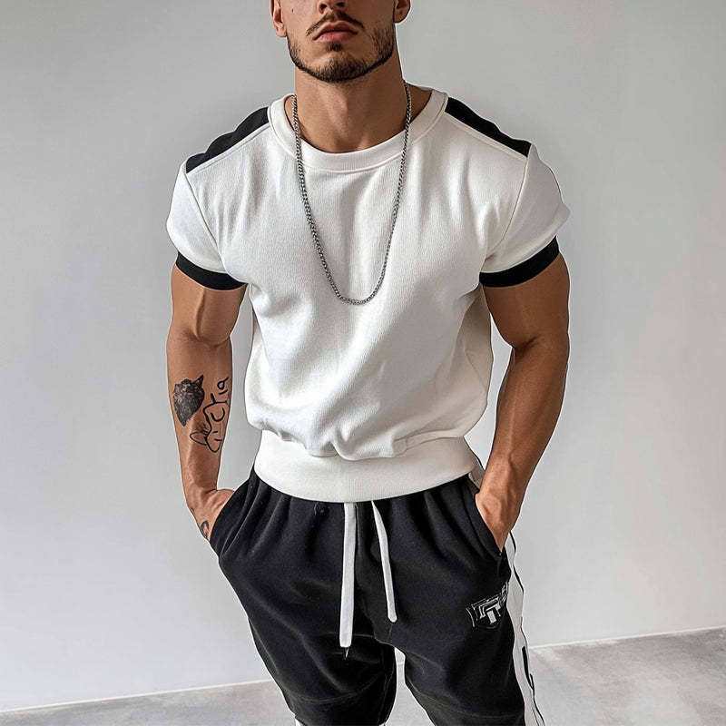 Camiseta deportiva de manga corta con cuello redondo y colores contrastantes para hombre