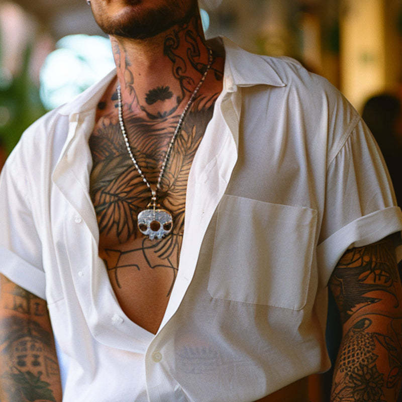 Camisa de manga corta con solapa de algodón liso para hombre