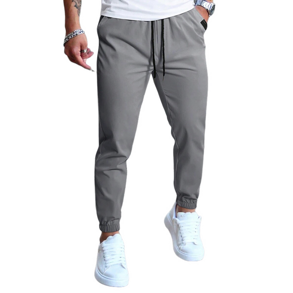 Pantalones casuales de cintura elástica de color liso para hombre 