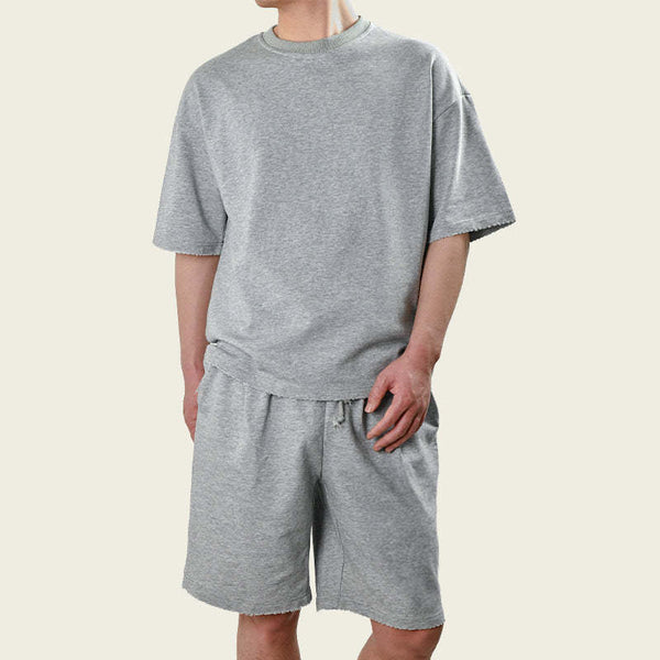 Conjunto de camiseta y pantalones cortos holgados de manga corta para hombre