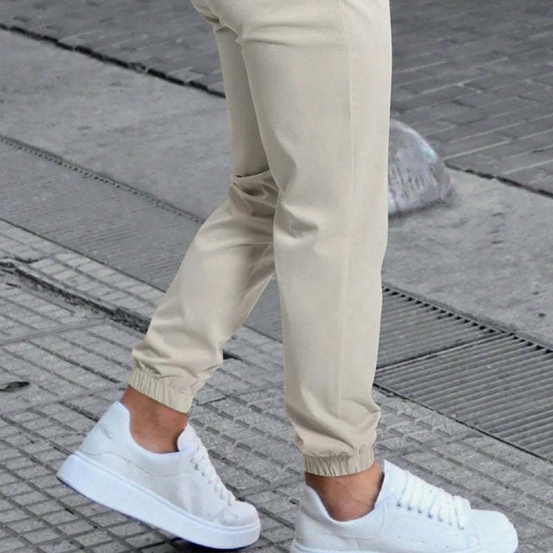Pantalones casuales de cintura elástica de color liso para hombre 