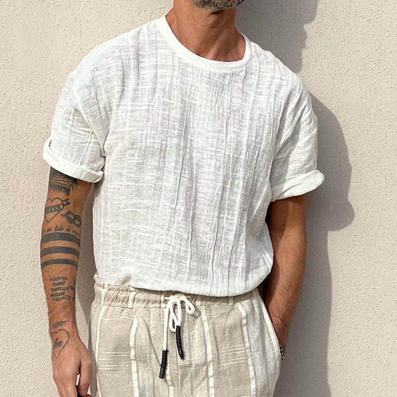 Camiseta de manga corta con cuello redondo y textura de color liso para hombre
