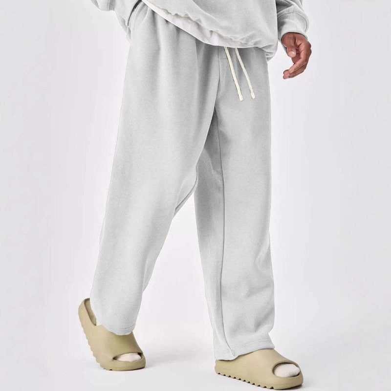 Pantalones deportivos rectos con cintura elástica y cordón de color liso para hombre
