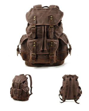 Mochila vintage de lona y cuero con múltiples bolsillos para hombre
