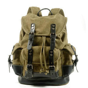 Mochila vintage de lona y cuero con múltiples bolsillos para hombre