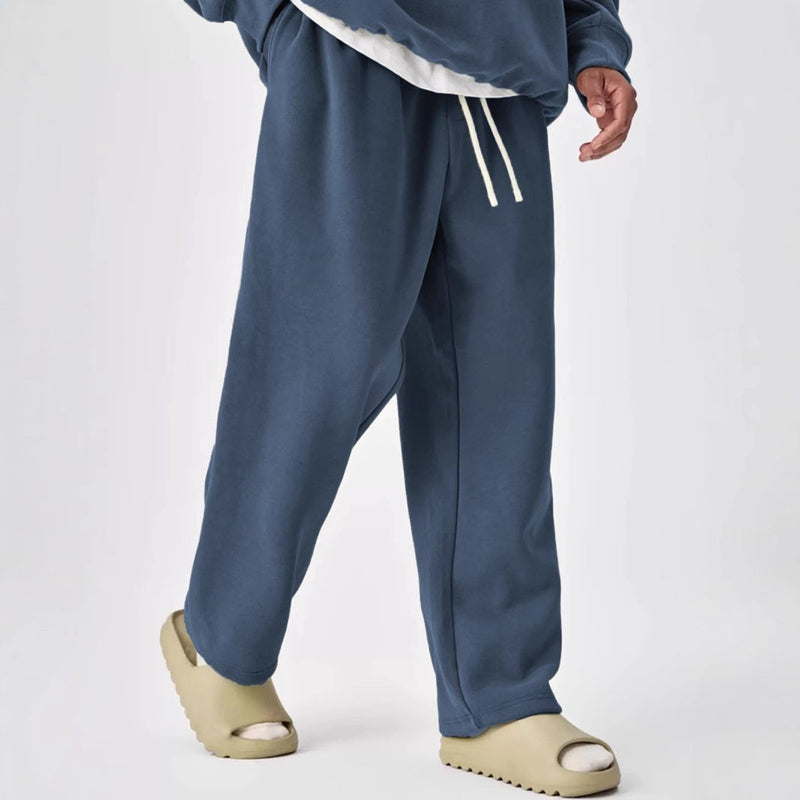 Pantalones deportivos rectos con cintura elástica y cordón de color liso para hombre