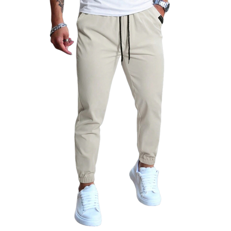 Pantalones casuales de cintura elástica de color liso para hombre 