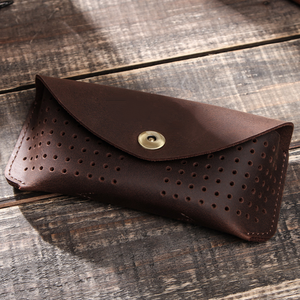 Bolsa de almacenamiento portátil para gafas de piel de vaca hueca de capa superior para hombre