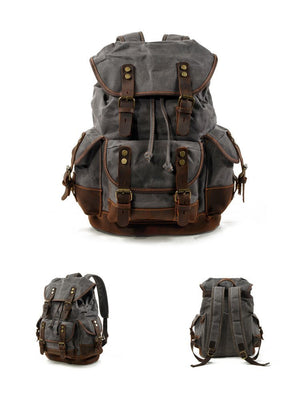 Mochila vintage de lona y cuero con múltiples bolsillos para hombre