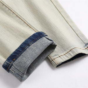 Vaqueros elásticos rotos con parches punk para hombre